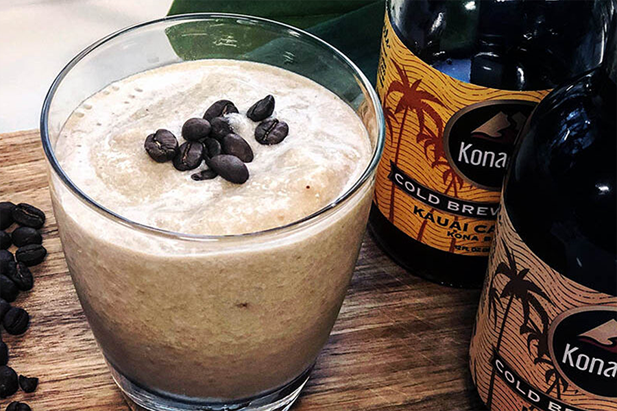 Glass of Creamy Coffee Cauliflower Smoothie topped with chocolate chips