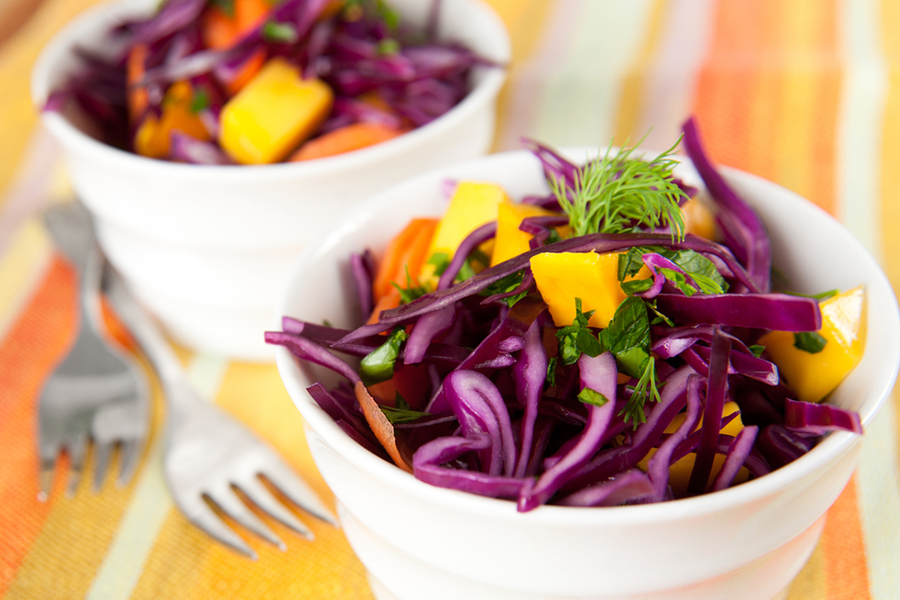 2 bowls of Mango, Carrot, Purple Cabbage, and Cilantro Salad with Miso Ginger Dressing