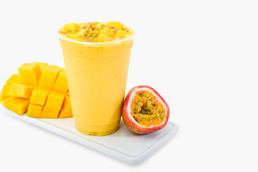 Cup of Passionfruit and Mango Smoothie with a mango and passionfruit next to it