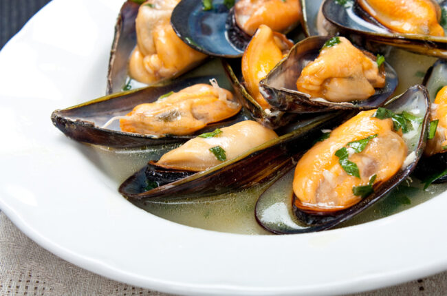 Bowl of steamed mussels with garlic and white wine
