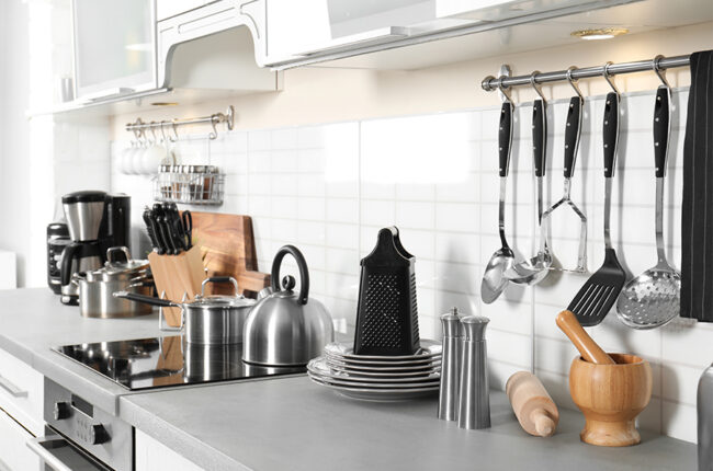 Kitchen counter with tools, wares, accessories.