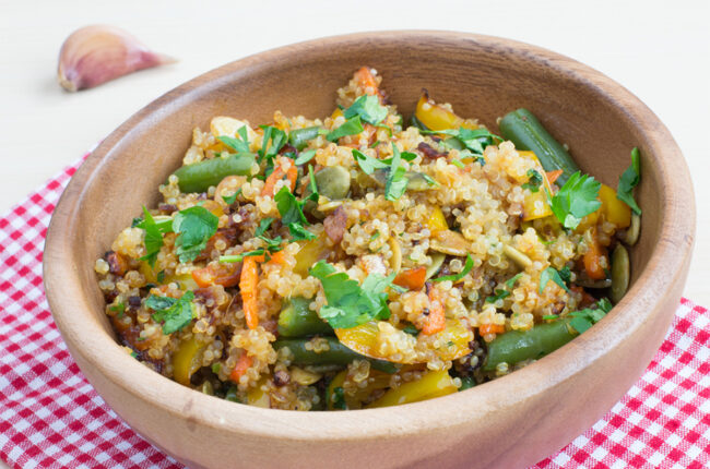 Carrot and Quinoa Salad with Fish Sauce in a wooden bowl