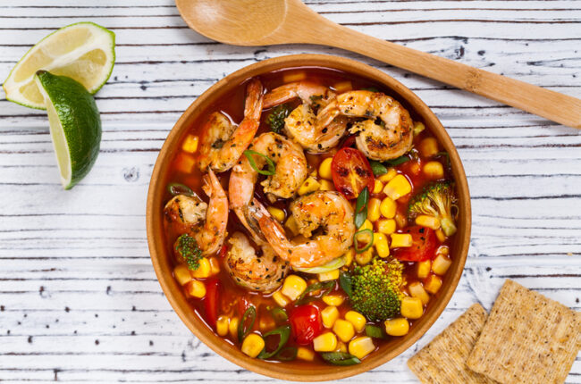 Bowl of shrimp, corn and tomato soup