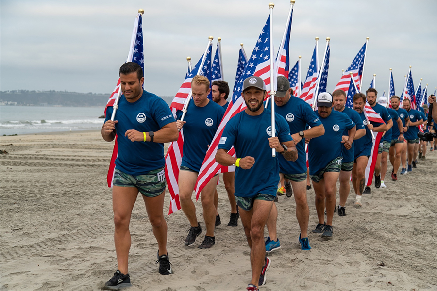 Veterans jogging across the beach at The Honor Foundation's Swim for SOF event