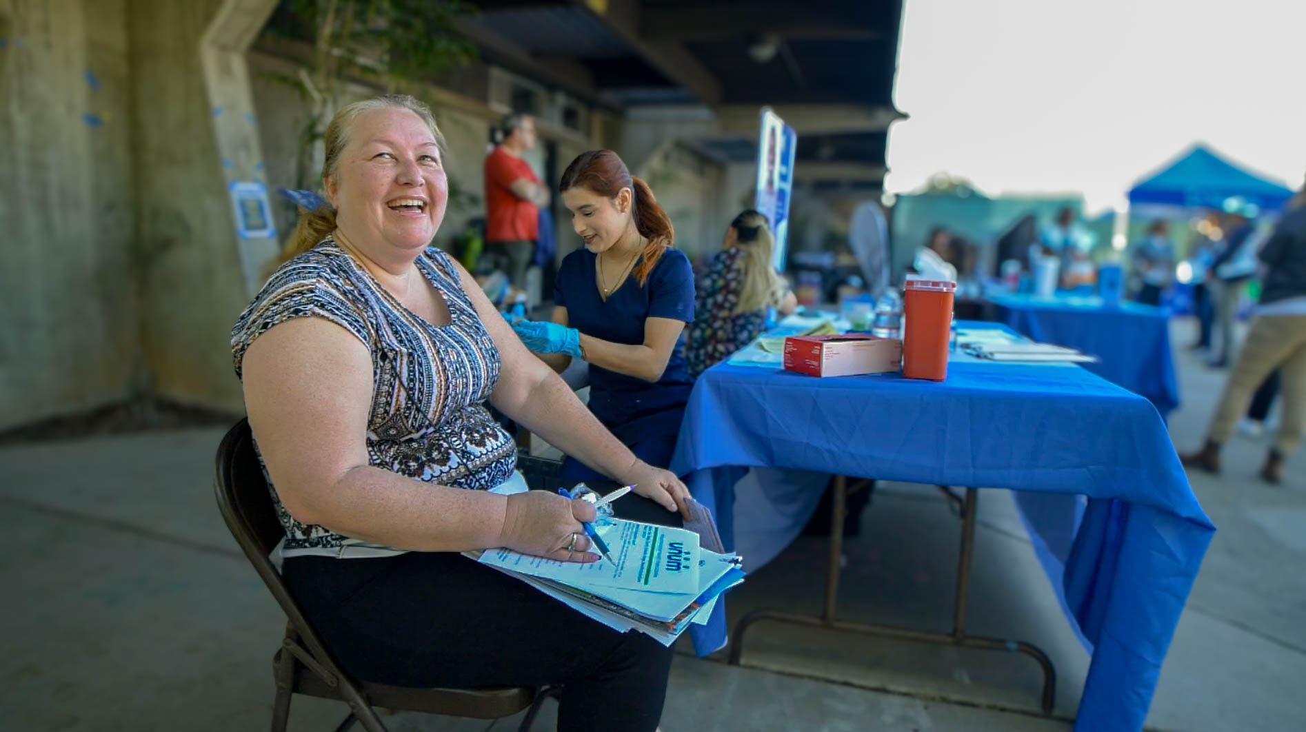 Photo of a woman getting her flu shot at a Health Fair