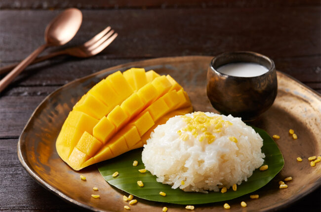 Mango Sticky Rice with a mango on a plate