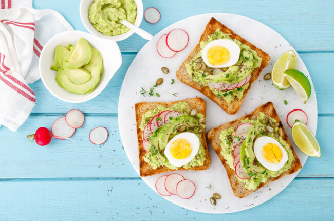 3 slices of avocado toast with hard boiled eggs