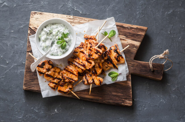 Oregano and Garlic Chicken Skewers with a bowl of Tzatziki Sauce
