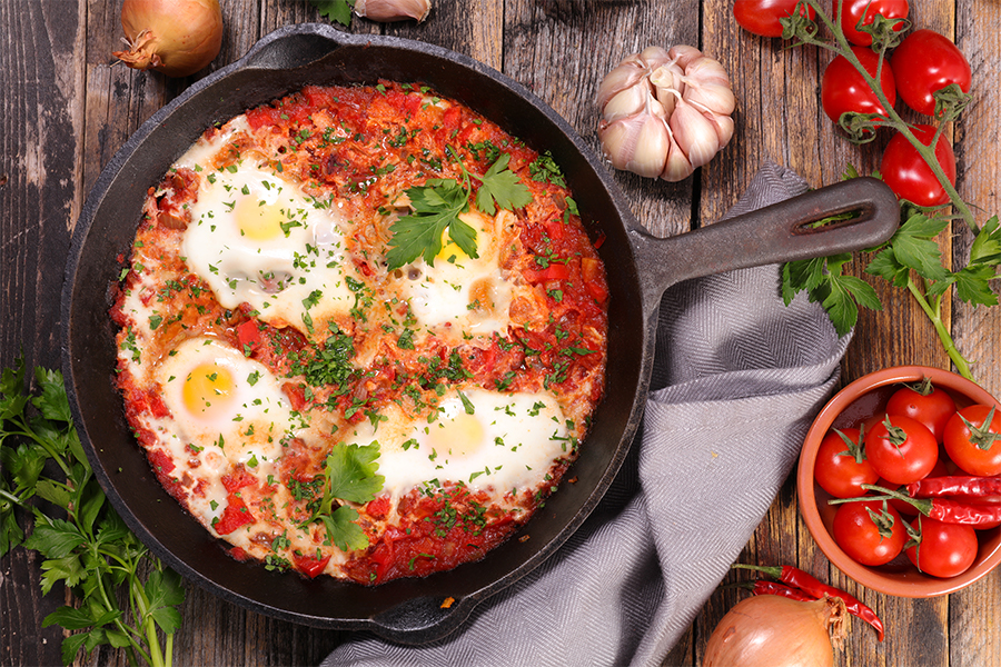Cast iron skillet with tomatoes and eggs