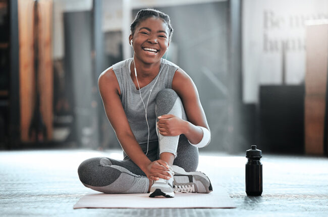 Gym, portrait or happy black woman on break after a workout, exercise or training for fitness. Funny, smile or healthy sports girl or female African athlete smiling or relaxing with positive mindset