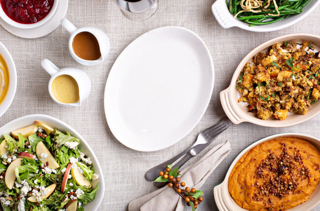 Traditional Thanksgiving table with copy space on empty plate