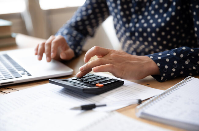 woman using calculator