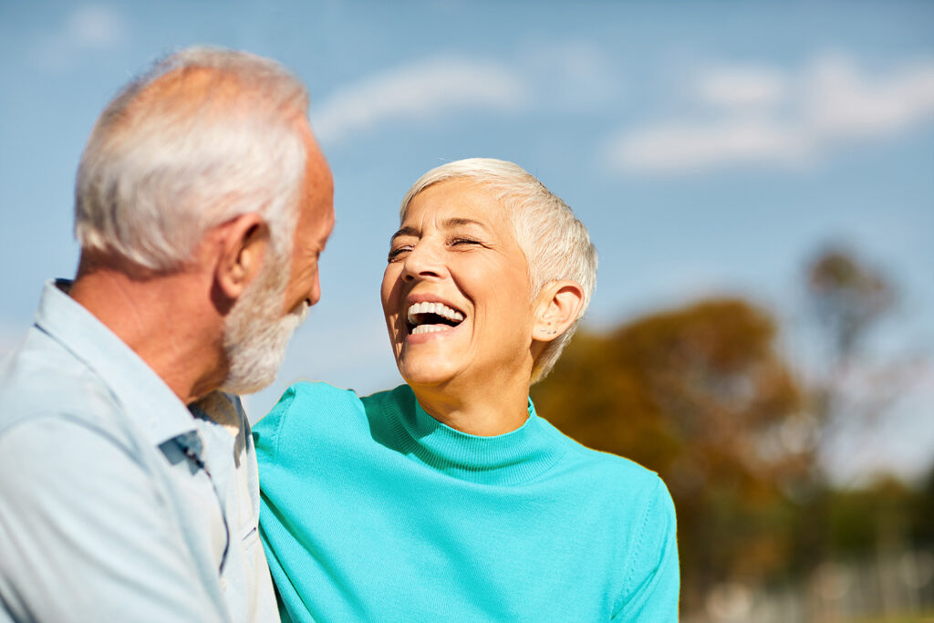 Couple smiling at each other.